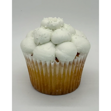 Cupcake with white frosting and sprinkles on top.