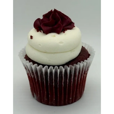 Red velvet cupcake with white and red frosting swirl.