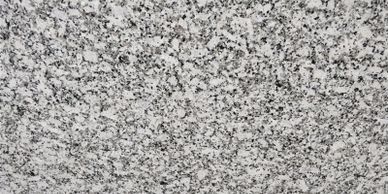 Close-up of a speckled gray granite surface.