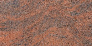 Close-up of orange and gray textured stone surface.