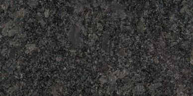 Close-up of dark granite stone texture with speckled pattern.