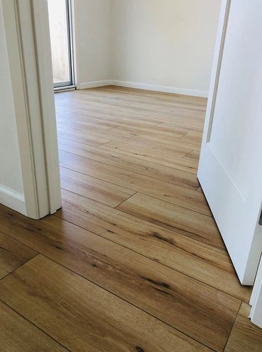 Light brown hardwood floors in the hall