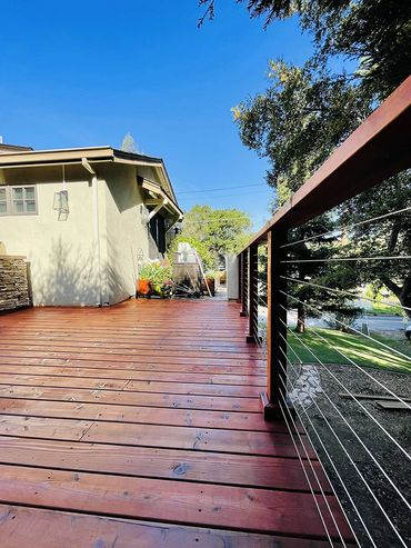 dark brown deck with fence