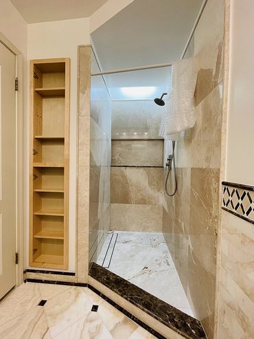 Bathroom remodeled by Top Line Remodeling Inc. Shower and shelves