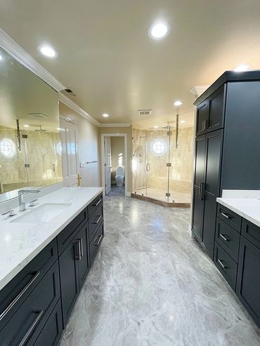 Bathroom renovated by Top Line Remodeling Inc. Very spacious room with black cabinets