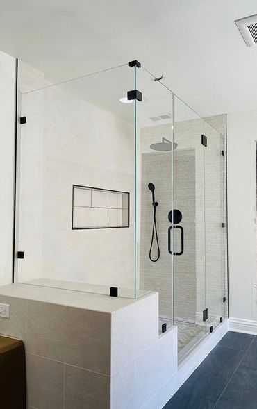 white textured shower with a bench