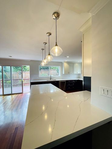 white breakfast area in a dark color kitchen