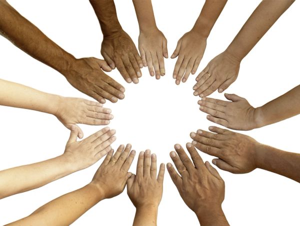 Diverse hands in a circle showing unity.