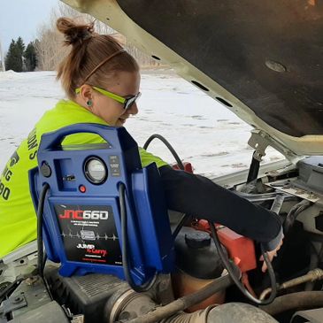 A scenic view of a mountain landscape during sunset with vibrant colors in the sky.