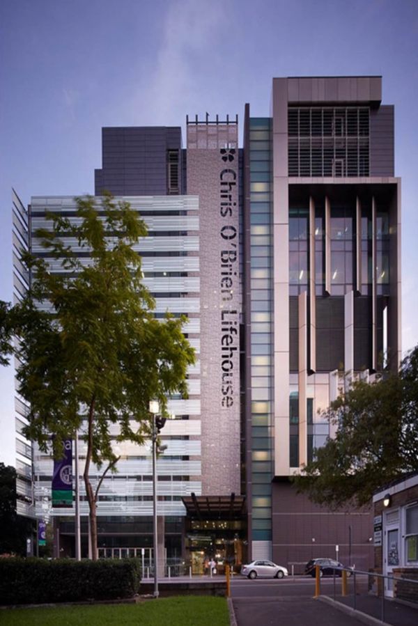 Modern Chris O'Brien Lifehouse hospital building at dusk.