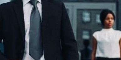Man in a suit and a woman. 