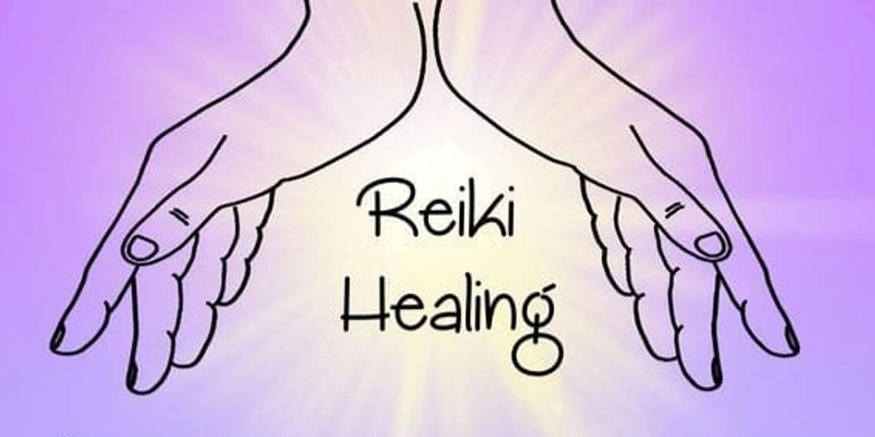 Reiki practitioner channeling healing energy with glowing hands.