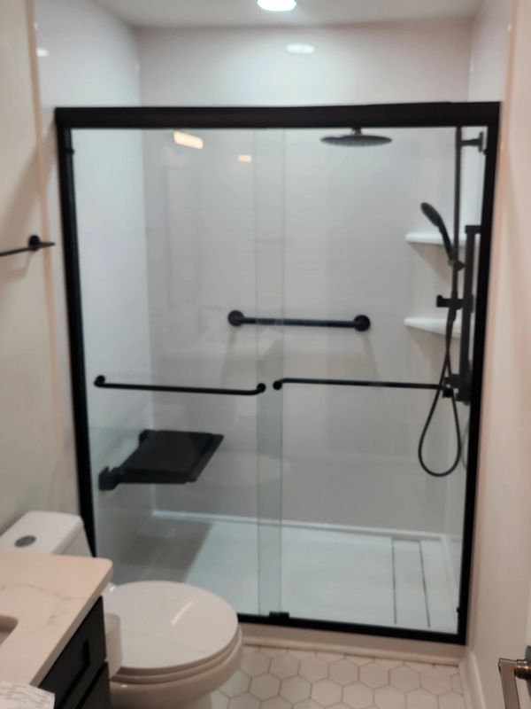Stepping over a tub getting harder? We convert old tubs into low-entry walk-in showers with grab bar