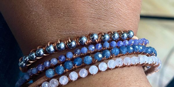 Custom copper and crystal bracelets designed to reflect personal intention, balance, and alignment.
