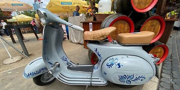 a white scooter with blue accent.