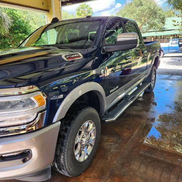 Shiny polished truck after clay bar treatment, spot free wash and wax