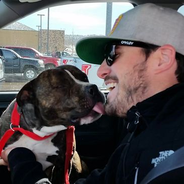 Transporting volunteer getting dog kisses