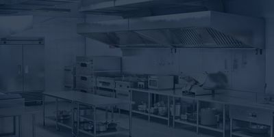 Professional commercial kitchen with stainless steel equipment and appliances.