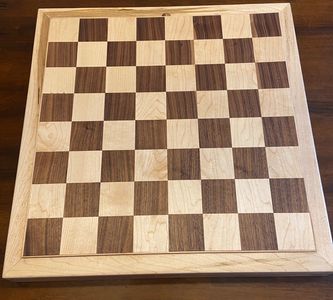 This custom chess set is made of walnut and maple. The squares are 2'" and built to house existing p