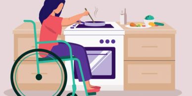 Woman in wheelchair cooking at kitchen stove with vegetables on counter.