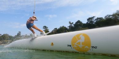 Wakeboarding in Cancun. Pro Rider Sanchezonboard. Steeze Frontboard on pipe in Mayan Water Complex