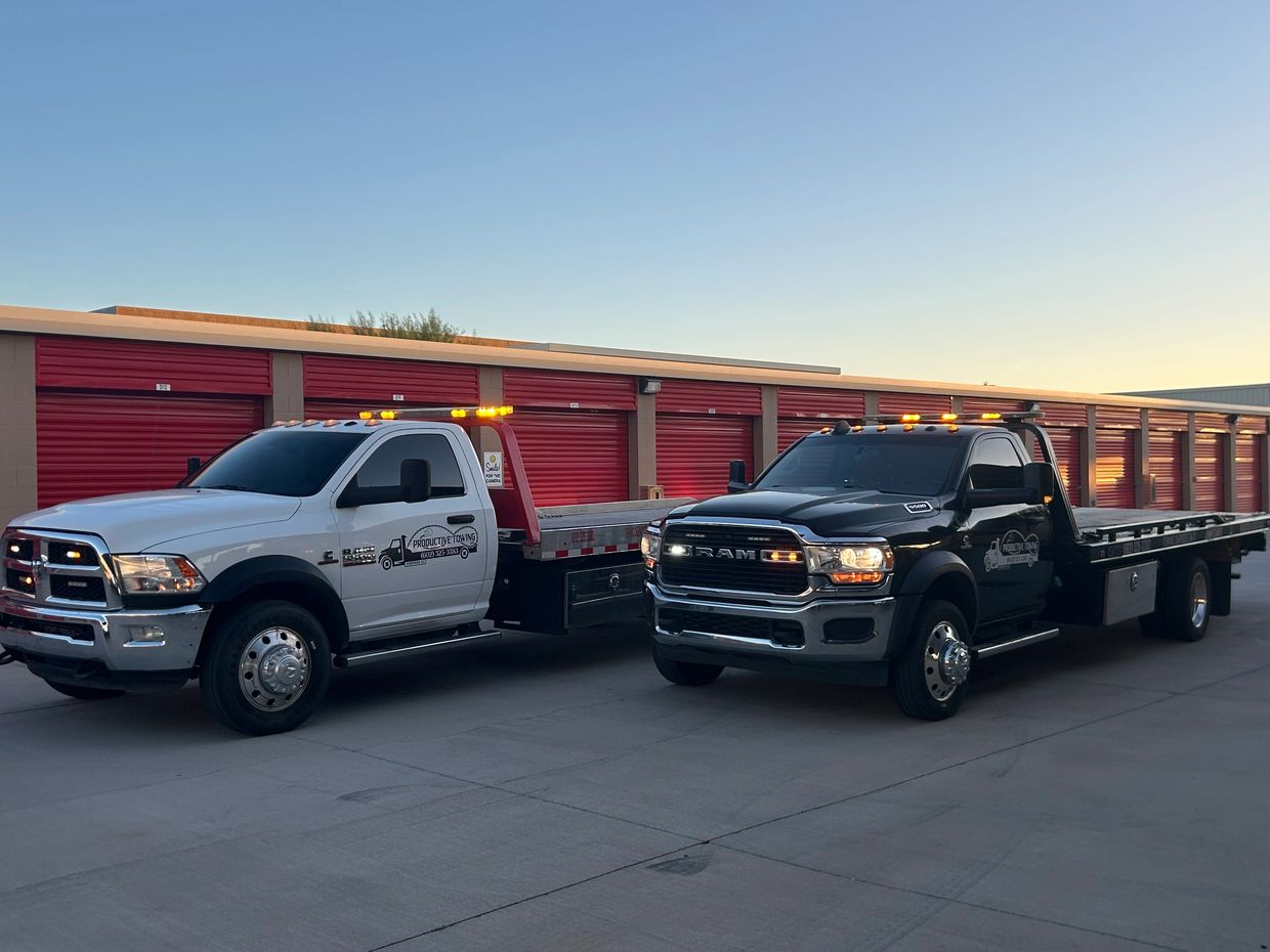 Productive Towing flatbed tow trucks parked in Surprise, AZ storage

