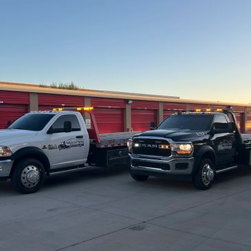 2 Productive Towing flat bed trucks