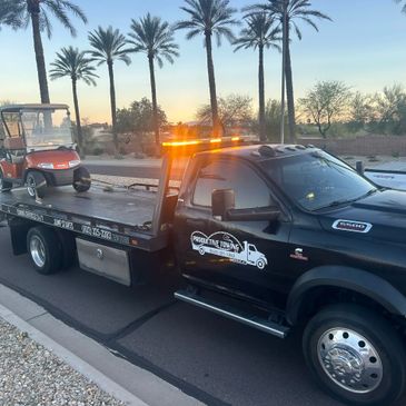 Productive Towing towing a golf cart on a flatbed