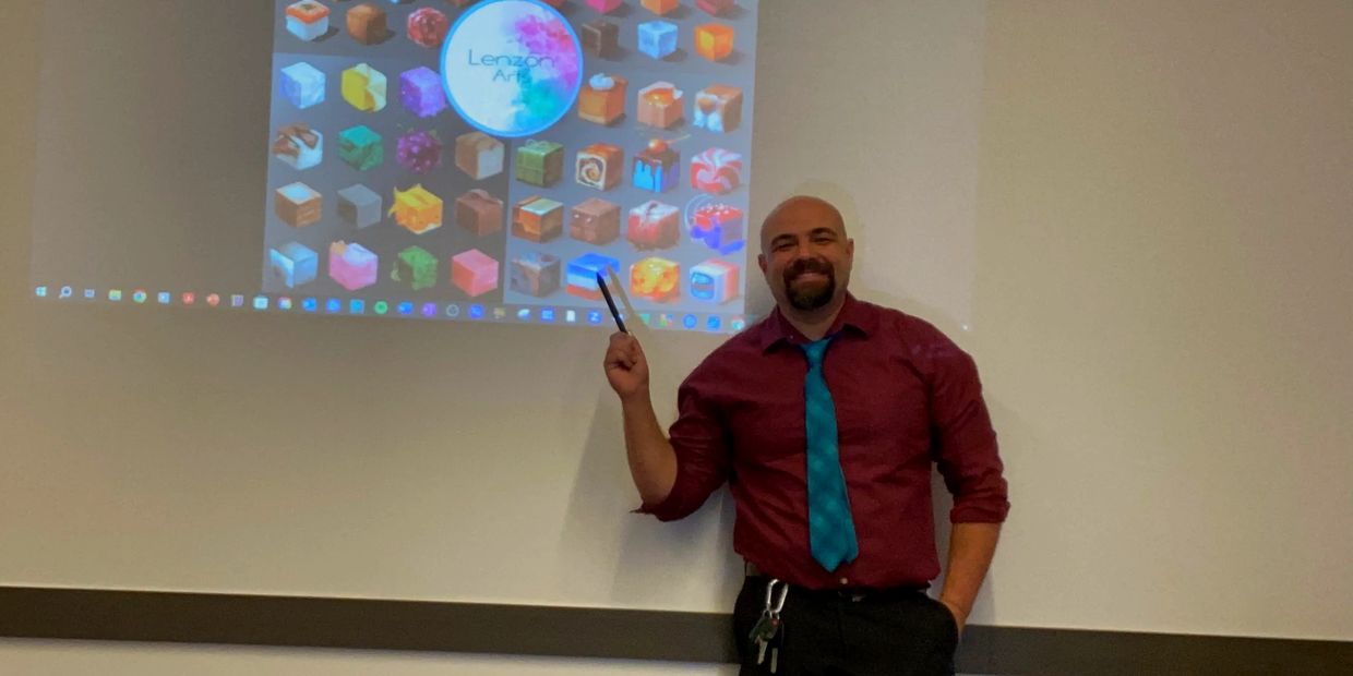 Art class presentation with colorful graphics on screen. Instructor perfect for art workshops."