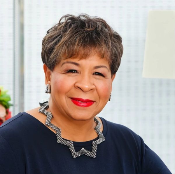 A Woman In A Blue Color Top