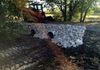 Double culvert drainage pipes and rip rap for this drainage swale crossing in Ponder, Texas.