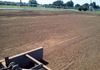 Final grading and leveling of dirt for a new arena in Aubrey, Texas.