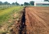 Excavating and grading soil for a new arena in Aubrey, Texas.