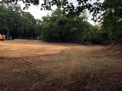 Topsoil and compacted clay to repair this backyard in Argyle, Texas.