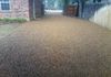 A brown pea gravel driveway and RV parking area in Krugerville, Texas.