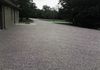 A topping of crushed limestone over a repaired gravel driveway in Valley View, Texas.