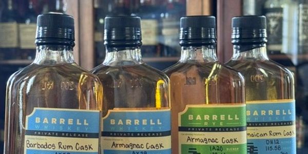 Four bottles of Barrell private release spirits with various cask finishes.