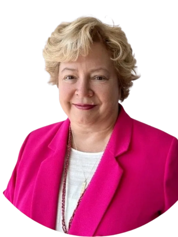Kate Leonard, a smiling woman with short blonde hair wearing a bright pink blazer.