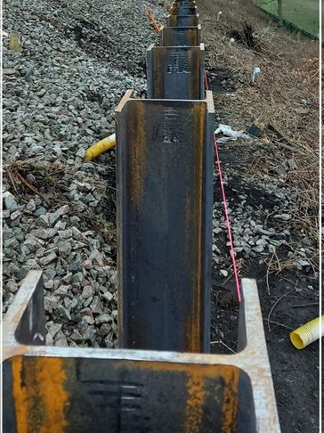 Galvanized steel piles by the side of the railway track