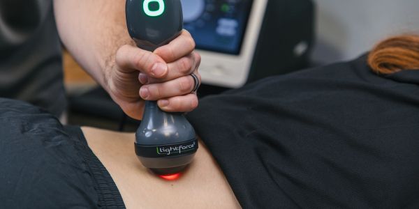 Therapy device applied on lower back.