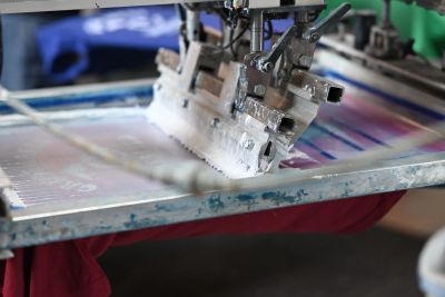 Screen printing process on fabric.