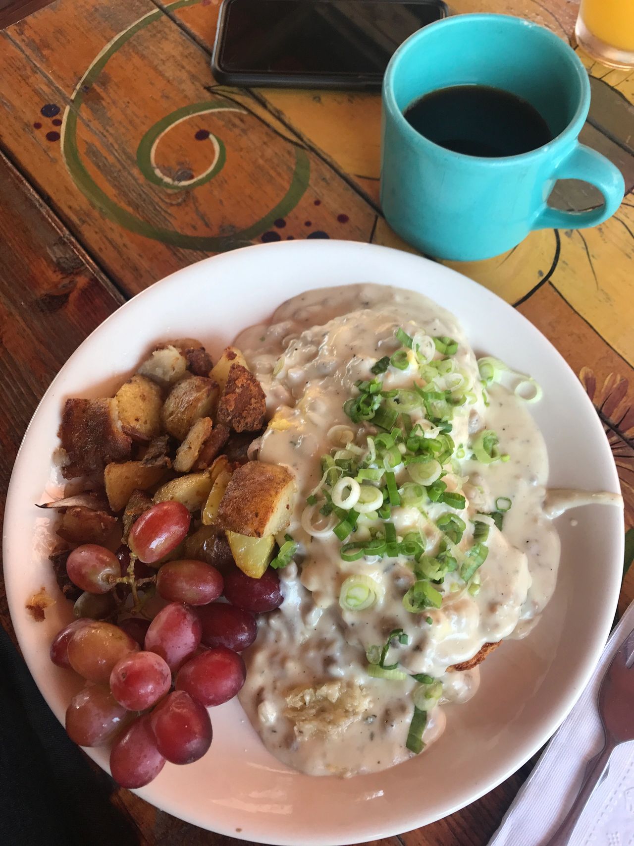 The Biscuits at Lucky's Cafe include scrambled eggs and sausage gravy