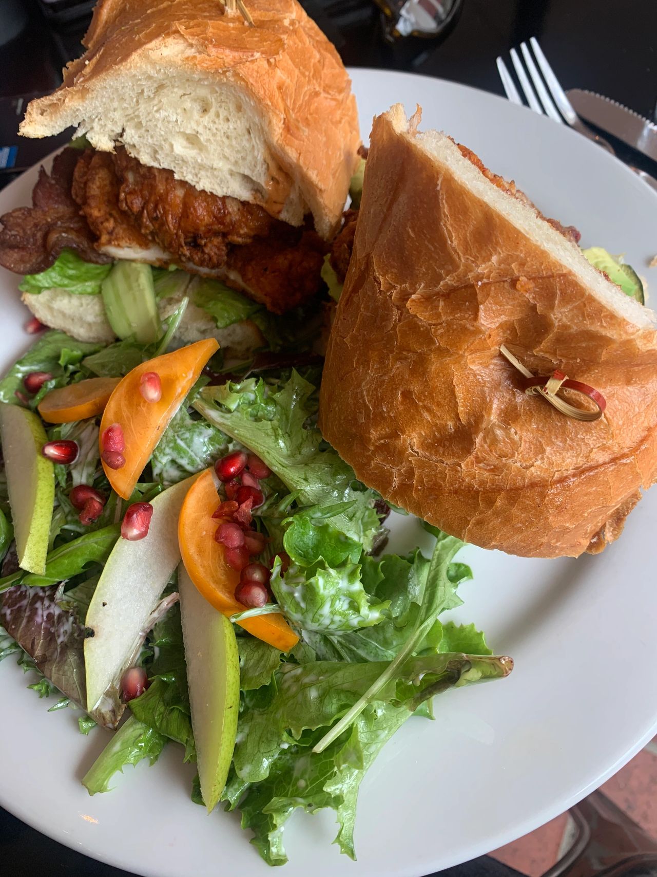The tasty crispy chicken sandwich complete with a side salad