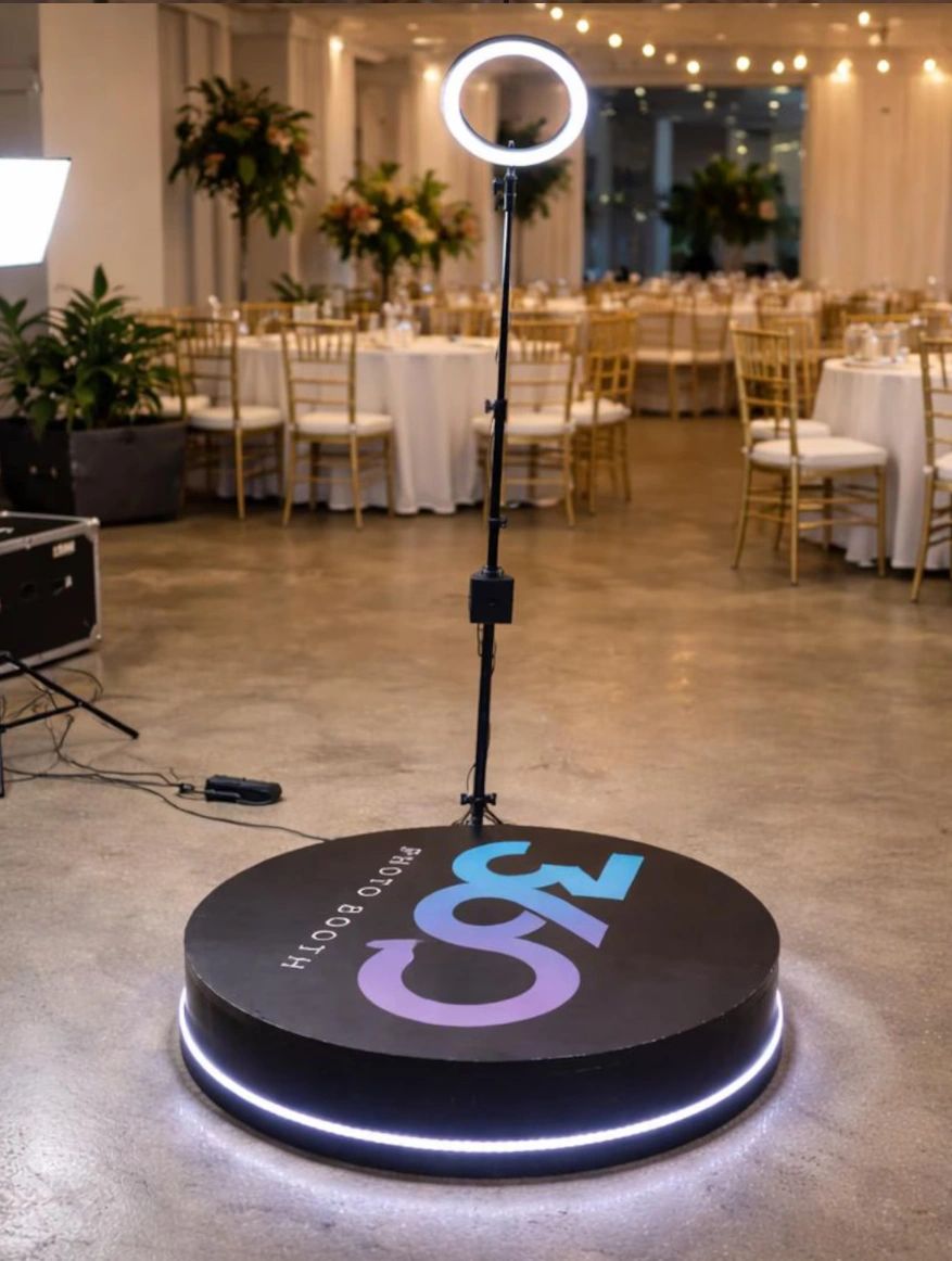 Modern photo booth with ring light at an event venue.