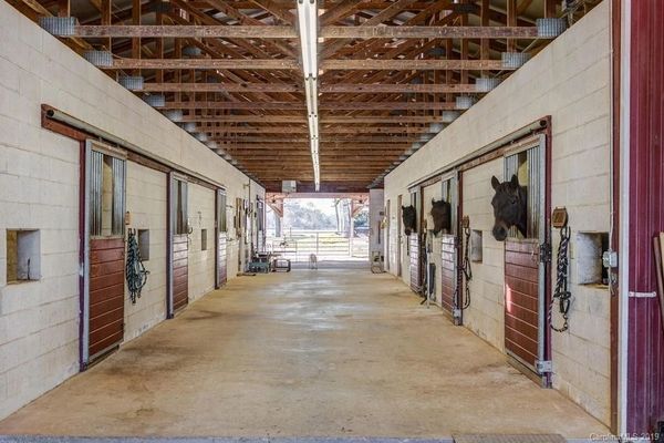 A view of some of the stalls for the horses to be kept in when weather prevents them from pasturing.