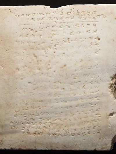 Ancient stone tablet with inscriptions.