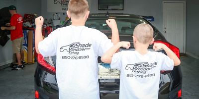 About Us - Family Owned and Operated- Son's of business owners showing off their support