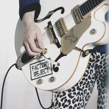 Coal Davie’s factory reject Gretsch white falcon and leopard print pants