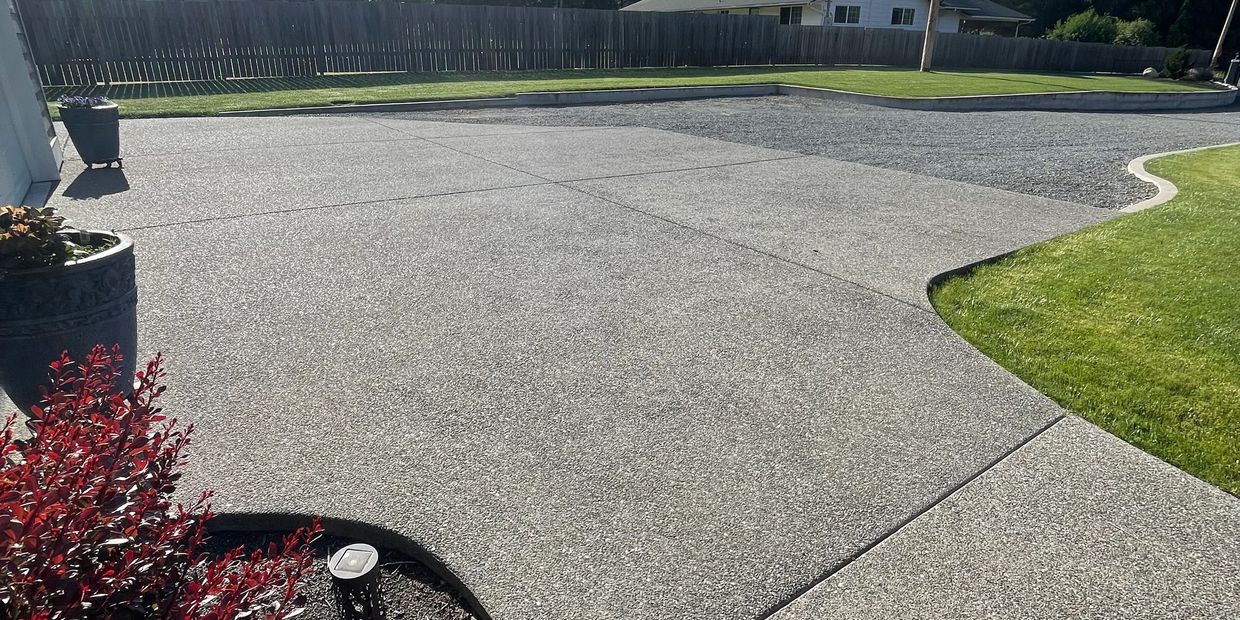 Broom finish curbs and poured concrete parking area in Stanwood, WA.