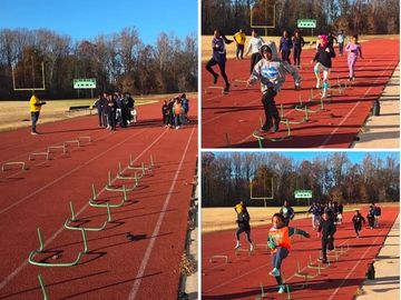 Kids practicing hurdles on a track field.